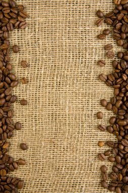 Frame of coffee beans on a sacking clipart