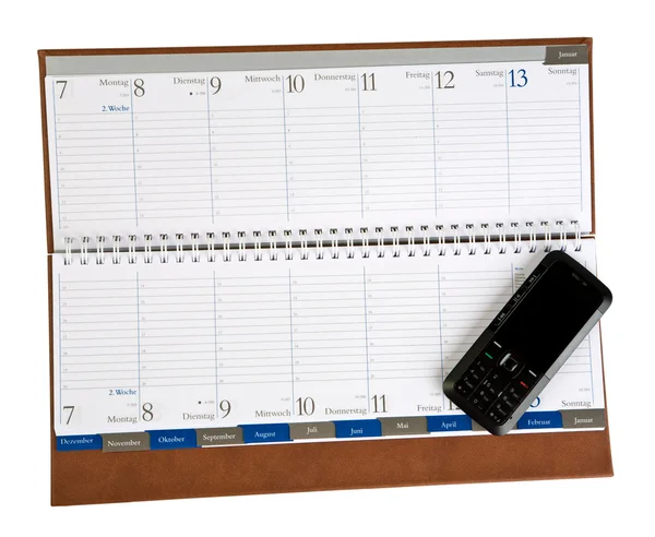Notebook with mobile phone isolated — Stock Photo, Image