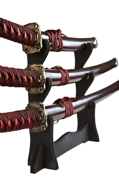 Samurai swords on a wood stand — Stock Photo, Image