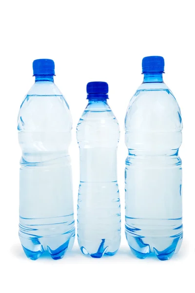 Izole üç mavi şişe — Stok fotoğraf