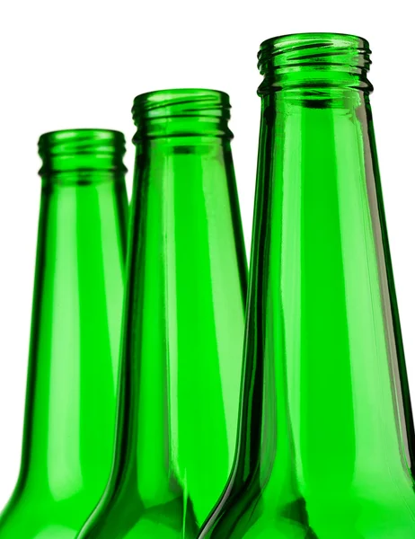 Parte superior de botellas verdes aisladas — Foto de Stock