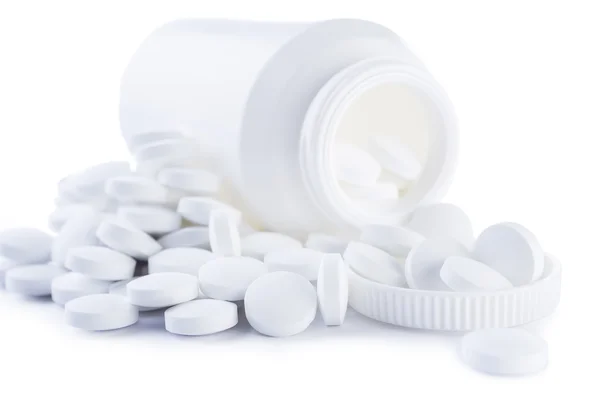 Tablette e flacone bianchi isolati — Foto Stock