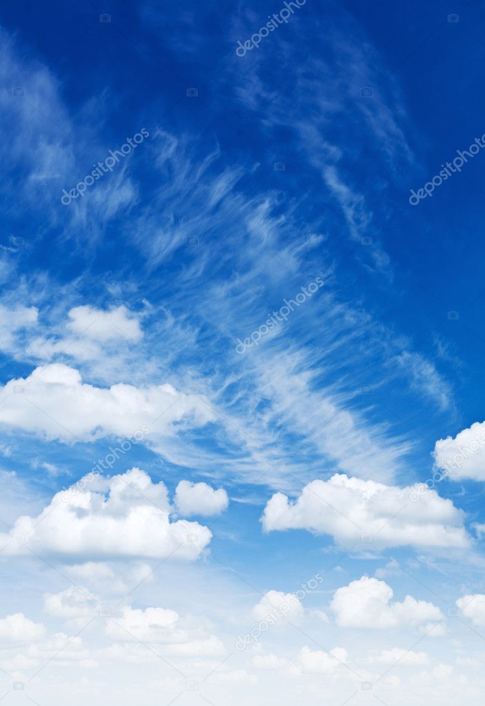 Cumulus and cirrus clouds on a blue sky