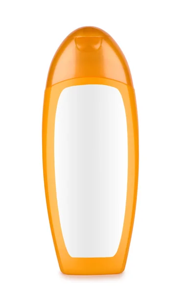 Апельсиновая бутылка шампуня — стоковое фото