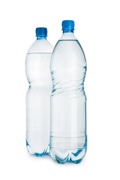 Две синие бутылки с изолированной водой — стоковое фото