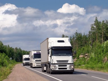 truck on a highway in a forest in summer  clipart