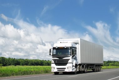 truck moving on a highway  clipart