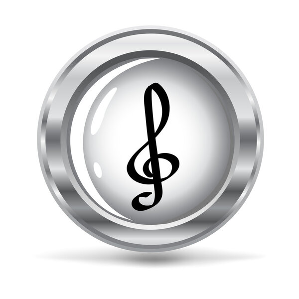 A metallic button with a clef