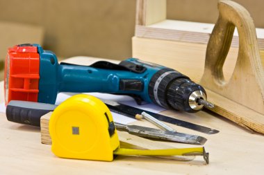 Joiner's tools lying on a workbench clipart