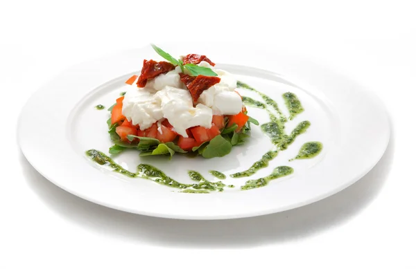 Piatto con pomodori, insalata ruccola — Foto Stock