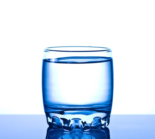 Glass of pouring water — Stock Photo, Image