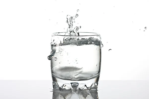 Water splashing from ice — Stock Photo, Image