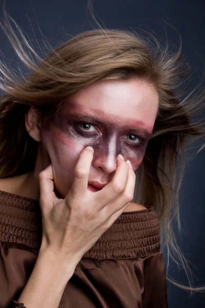 Young blond woman with aggressive mak — Stock Photo, Image