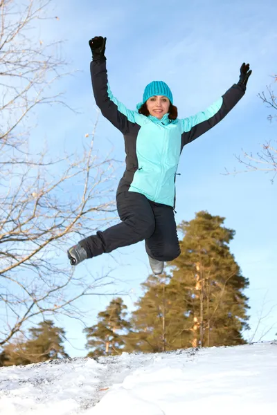 Young woman in the winter jump — Stock Photo, Image
