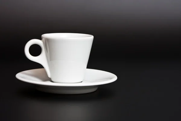 Cup of coffee on a black background — Stock Photo, Image