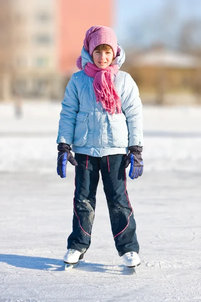 Girl on skates at the skating rink — Stock Photo, Image