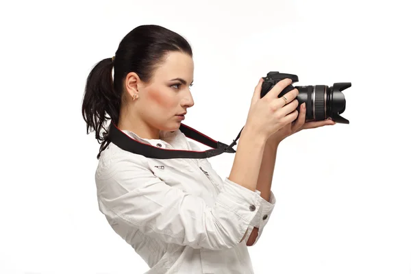 stock image Girl with the camera on a white