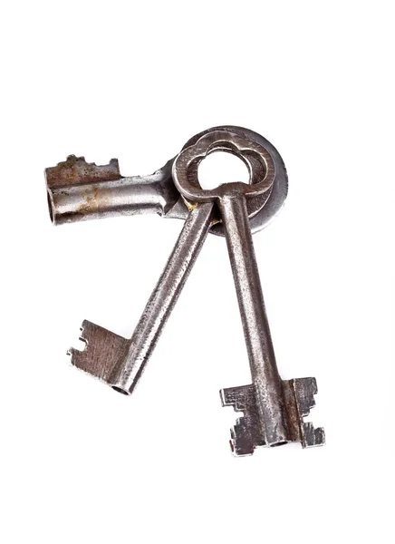 Drei alte Schlüssel auf weiß — Stockfoto
