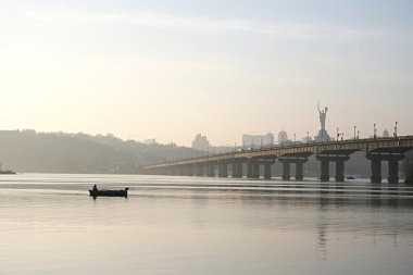 Fisherman near the bridge clipart