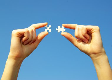 Puzzle in hands clipart