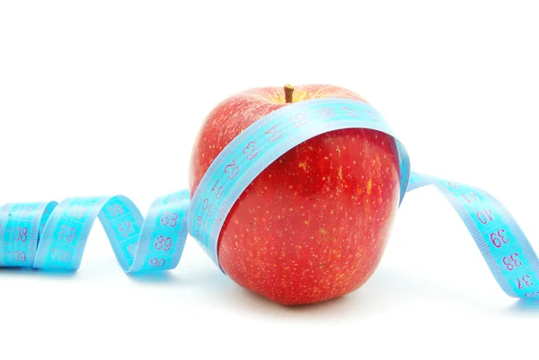 Jabłko i taśma pomiarowa — Zdjęcie stockowe