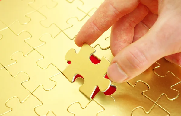 Ruce držící puzzle — Stock fotografie