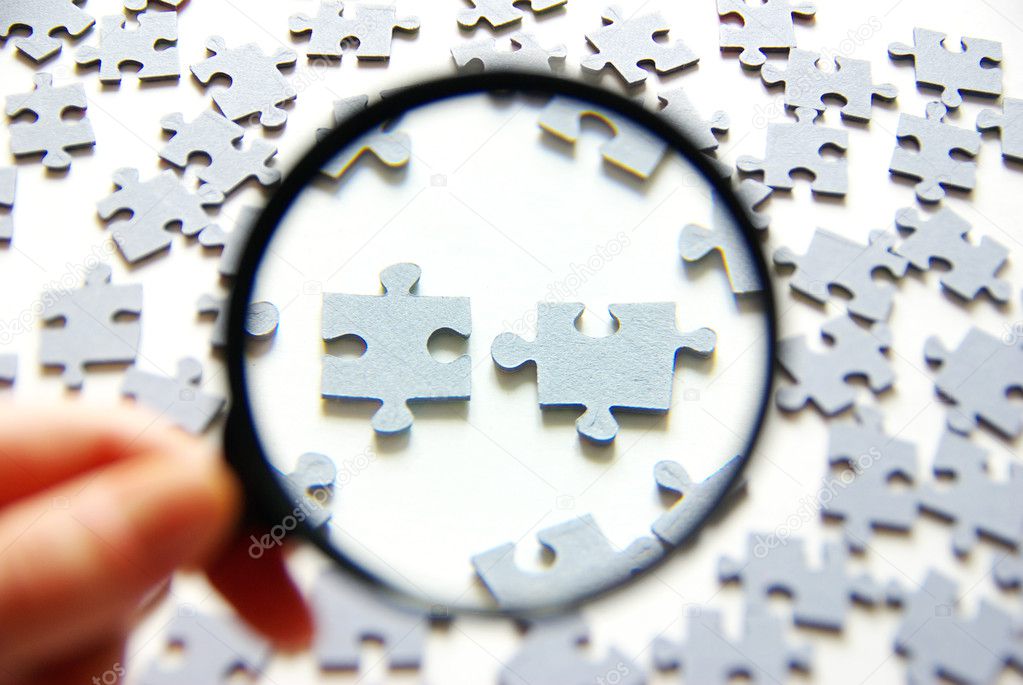 Magnifying glass and puzzle