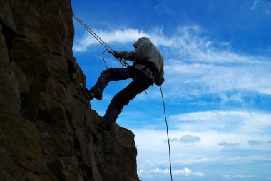 Climb on a mountain clipart