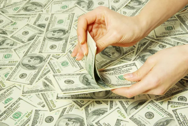 Hand with money Stock Image