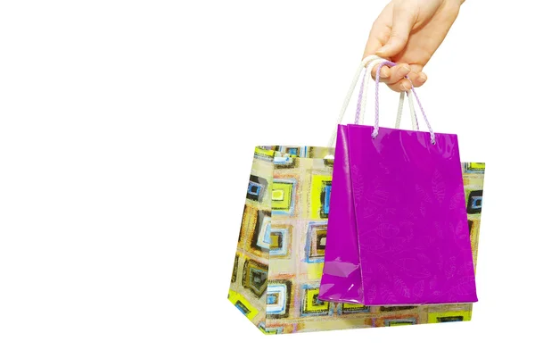 Mão segurando sacos de compras — Fotografia de Stock