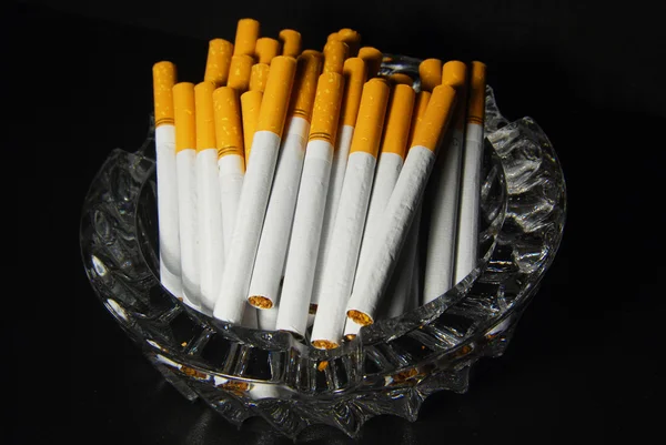 Lot Cigarettes Tray 스톡 사진