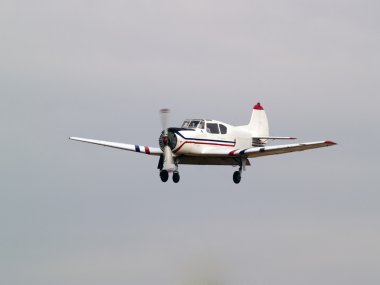 Private aircraft on final approach clipart