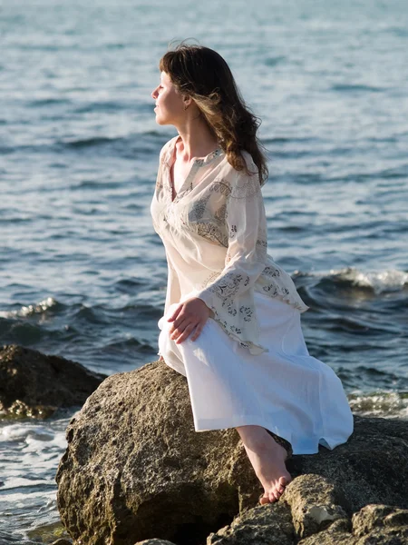 stock image Lady Sitting on Sea Rock