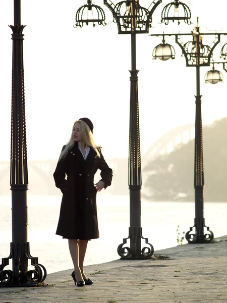 Beautiful blonde on promenade — Stock Photo, Image