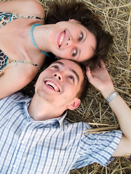 Lovely couple in straw — Stock Photo, Image