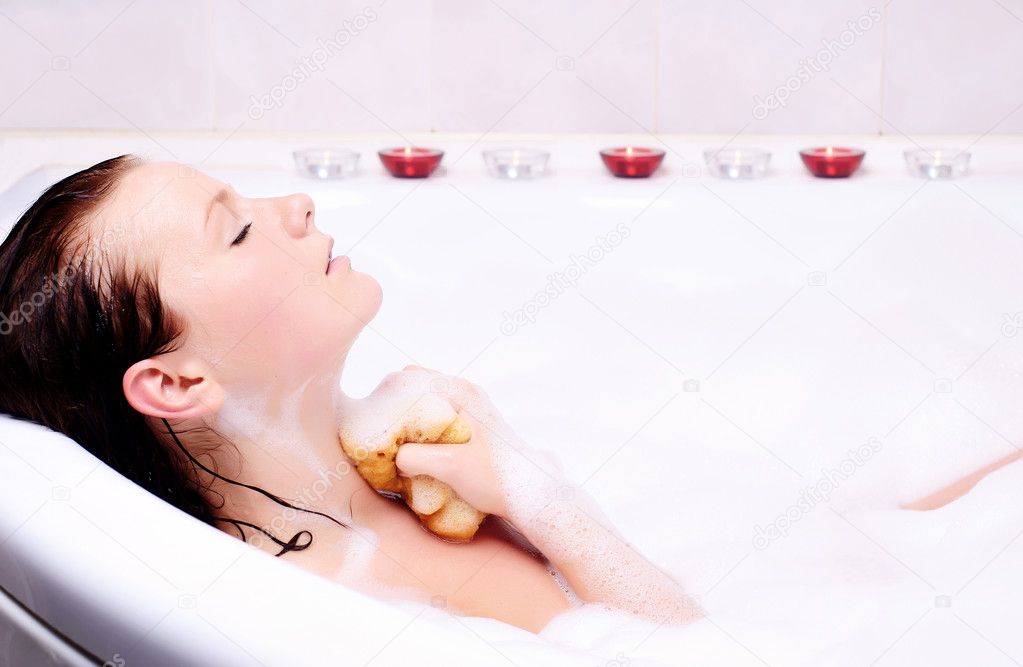 beautiful woman taking a bubble bath 