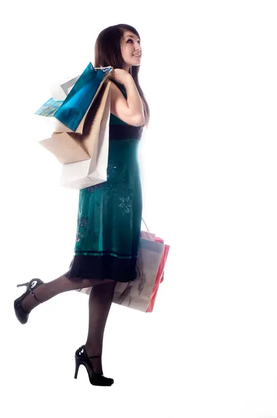 Een aantrekkelijke jonge dame uit winkelen. — Stockfoto