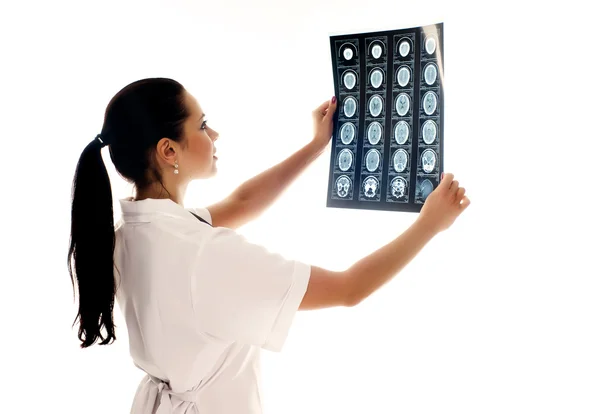Woman doctor with x-rays of brain — Stock Photo, Image