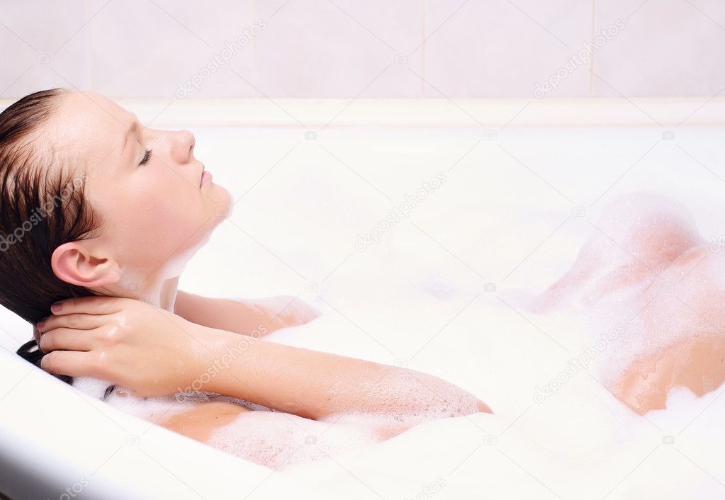 Woman enjoys the bath-foam
