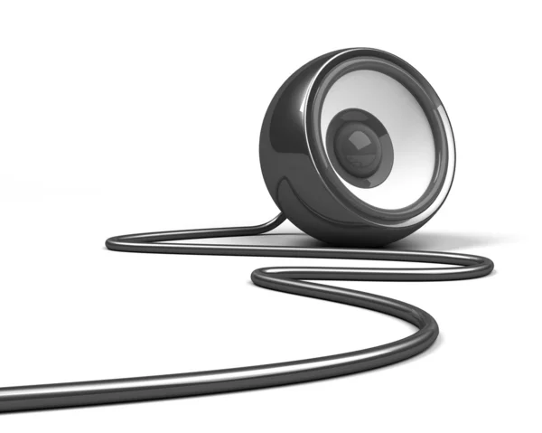 Черный динамик с кабелем поверх белого — стоковое фото