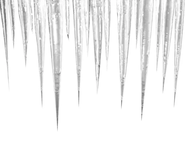 Beyaz üzerine buz sarkıtları — Stok fotoğraf