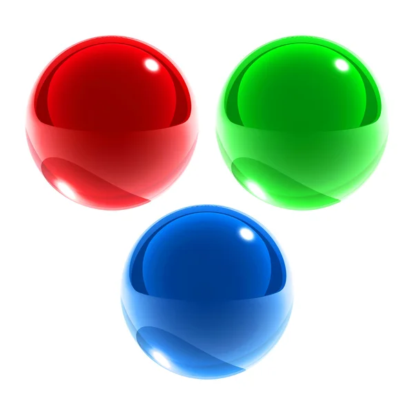 Geïsoleerd rood groen blauwe glazen bollen — Stockfoto