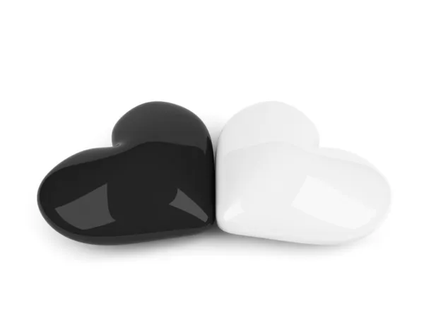 Czarno-białe serca leżącego nad białym — Zdjęcie stockowe