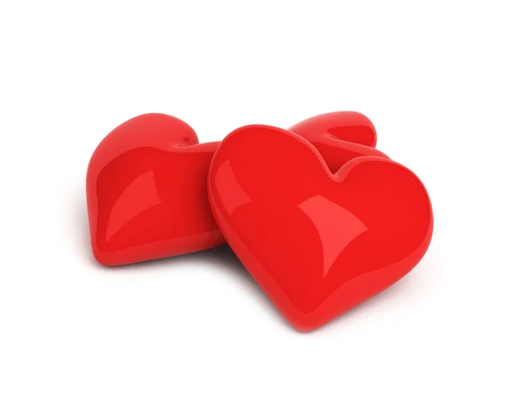 Beyaz zemin üzerinde üç kırmızı Kalpler — Stok fotoğraf
