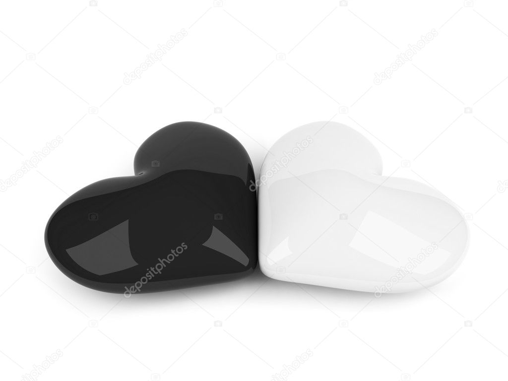 Black and white hearts lying over white