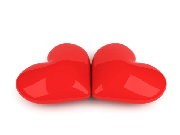 Zwei rote Herzen liegen über weißen — Stockfoto