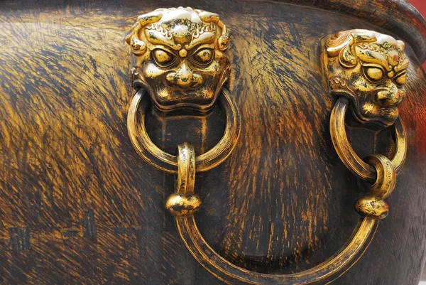 stock image Ancient bronze lions as a handle of vat