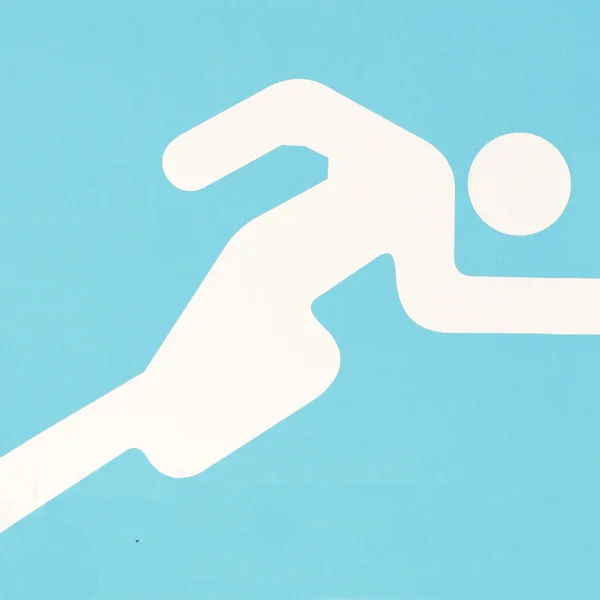 Символ бегущего человека — стоковое фото