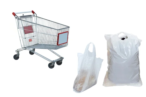 Bolsas de plástico y el carrito de la compra — Foto de Stock