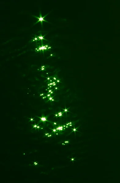 stock image Christmas tree from light on water